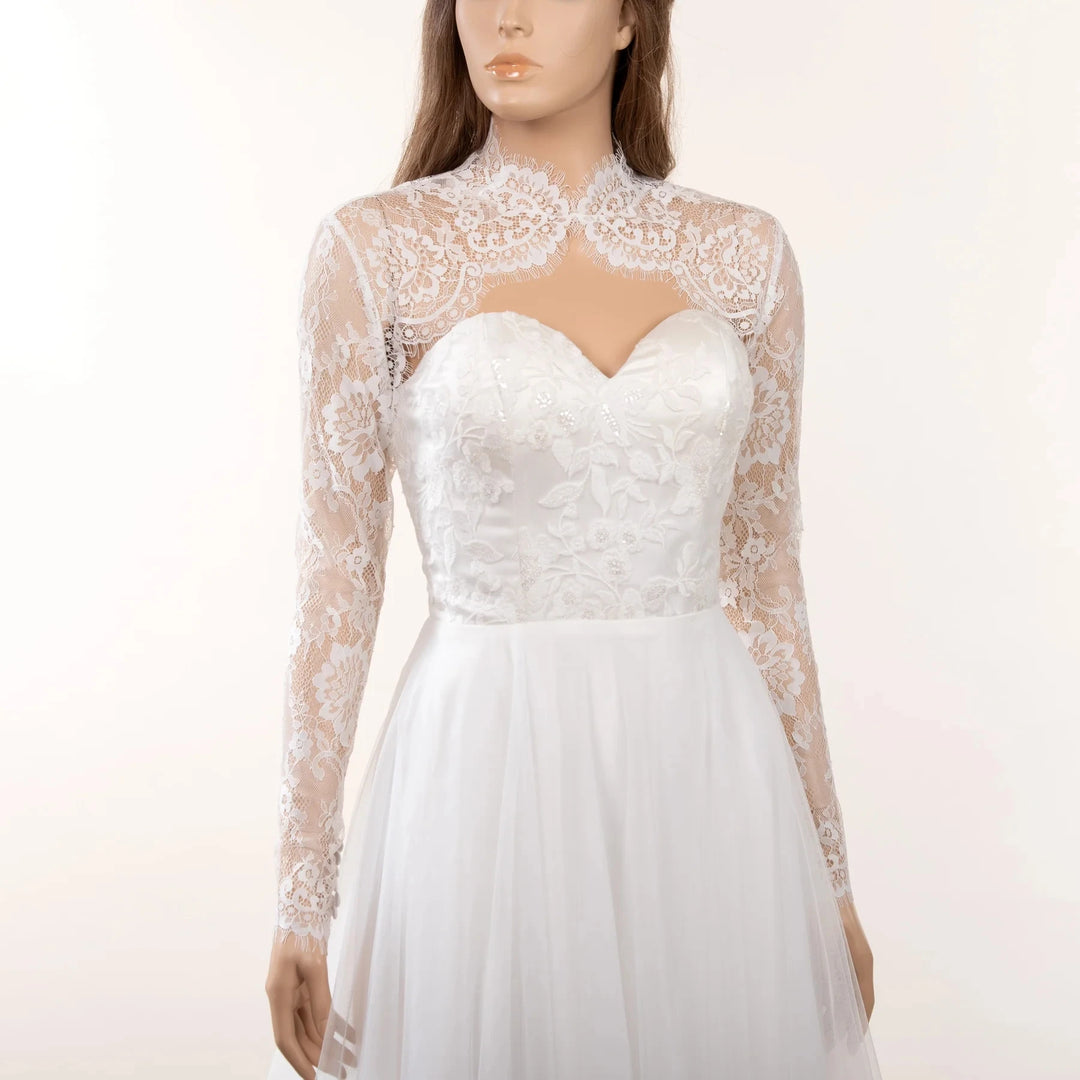 Off-white lace bridal jacket with high scalloped collar and sheer long sleeves