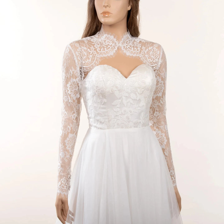 Off-white lace bridal jacket with high scalloped collar and sheer long sleeves
