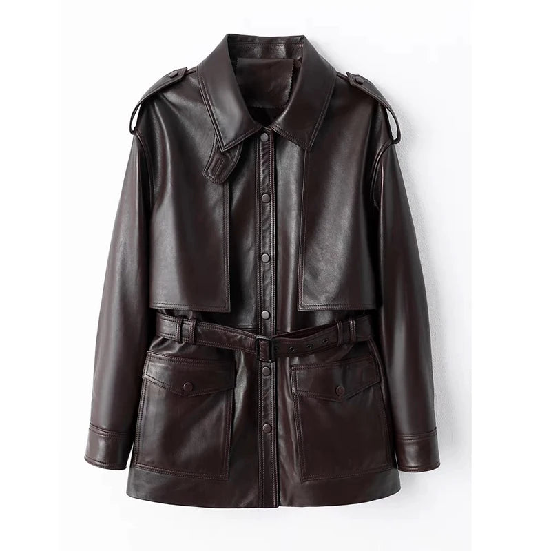 Dark brown leather coat with point collar, snap buttons, shoulder straps, and waist belt