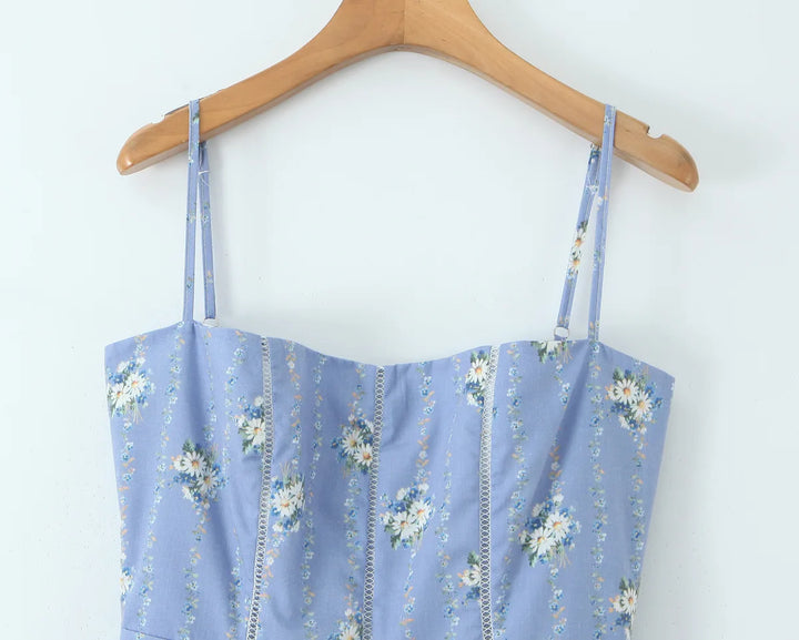 Blue daisy-print sundress with wide straps and square neckline