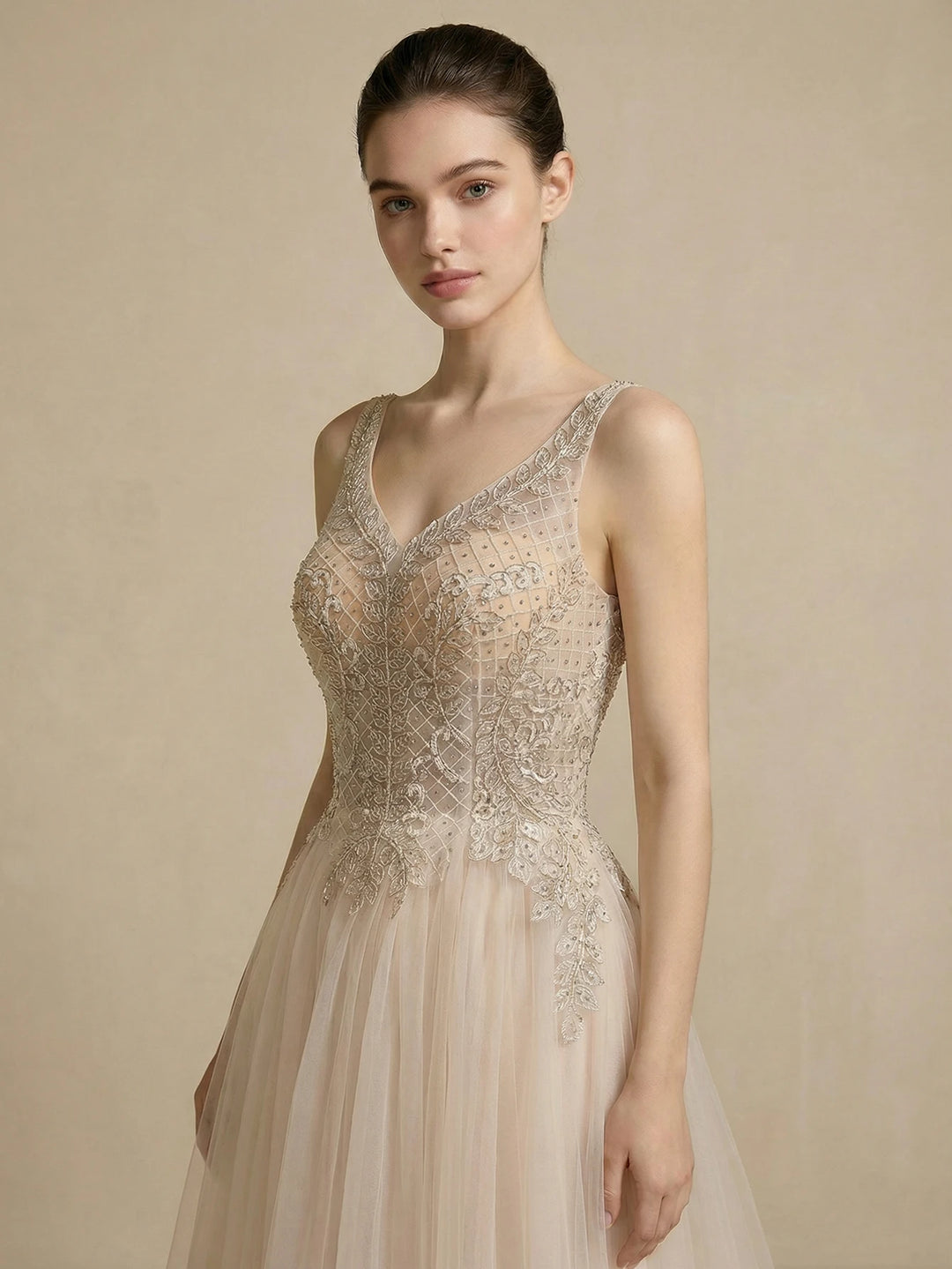 Ivory bridal gown with V-neck beaded mesh bodice and sleeveless tulle skirt