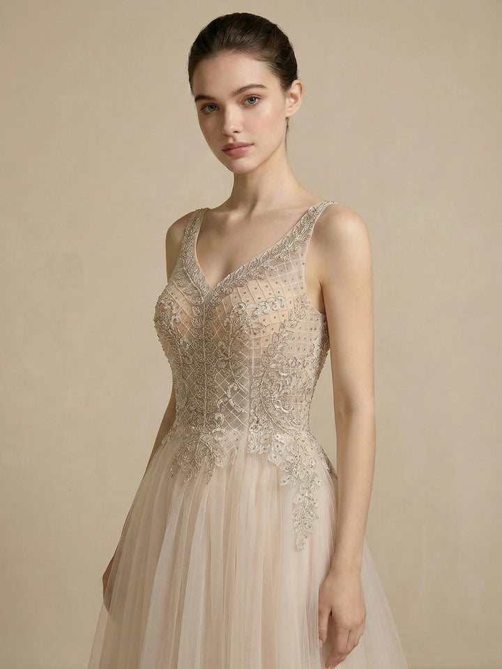 Ivory bridal gown with V-neck beaded mesh bodice and sleeveless tulle skirt
