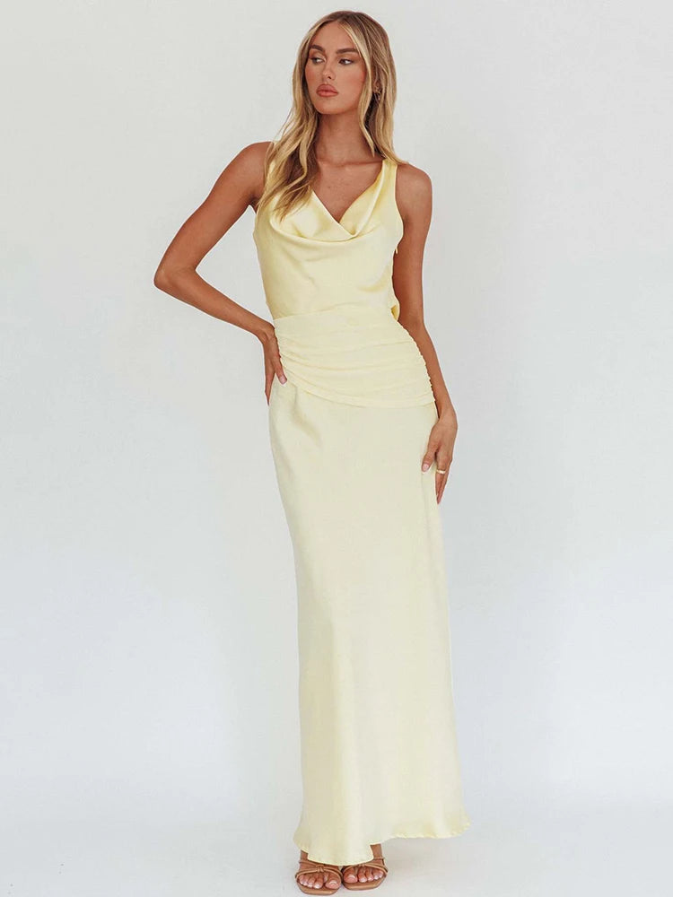Light yellow satin evening maxi dress with cowl V neckline and ruched waist seam