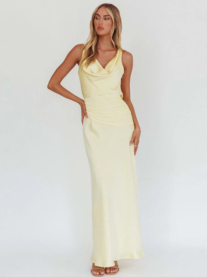 Light yellow satin evening maxi dress with cowl V neckline and ruched waist seam