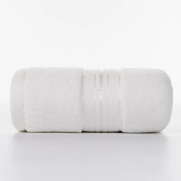 White face towel roll with stitched stripe bands and plush looped fabric