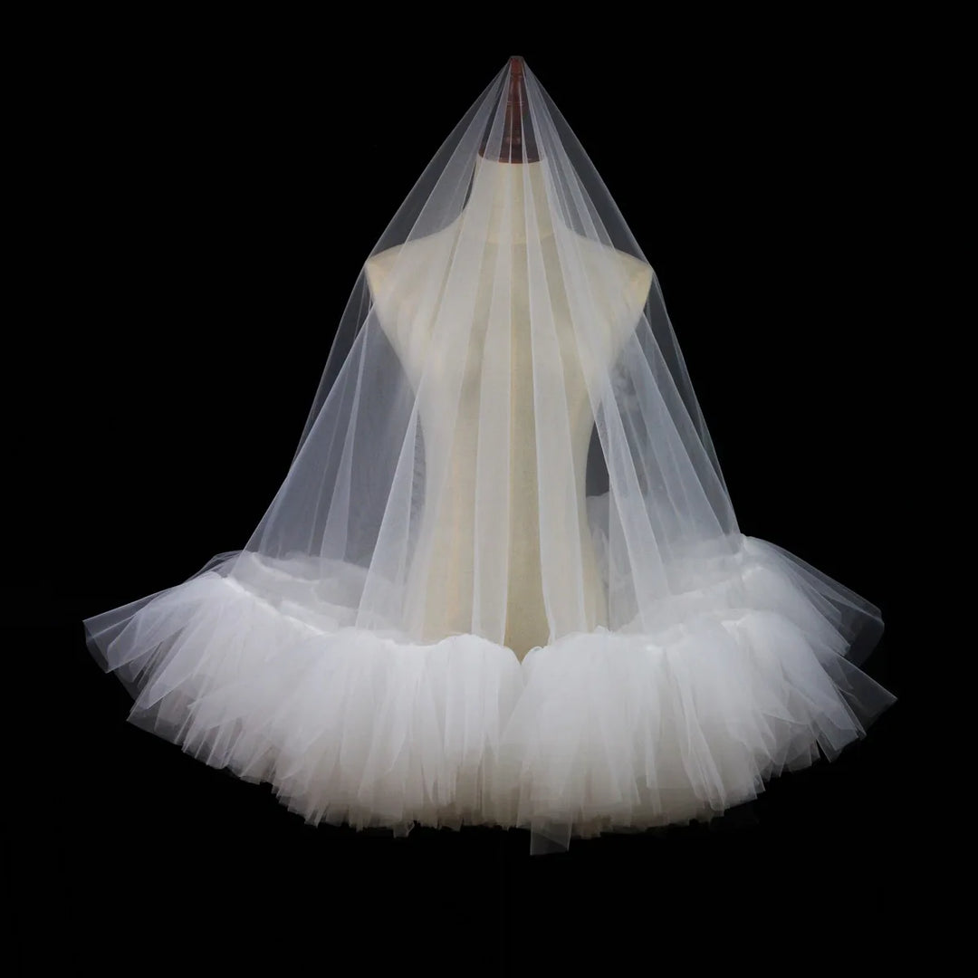 Ivory tulle bridal veil with tiered ruffle trim and sheer top