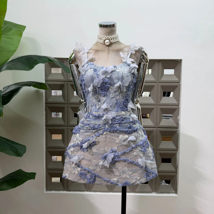 Blue lace corset mini dress with layered 3D floral appliques and pearl choker collar