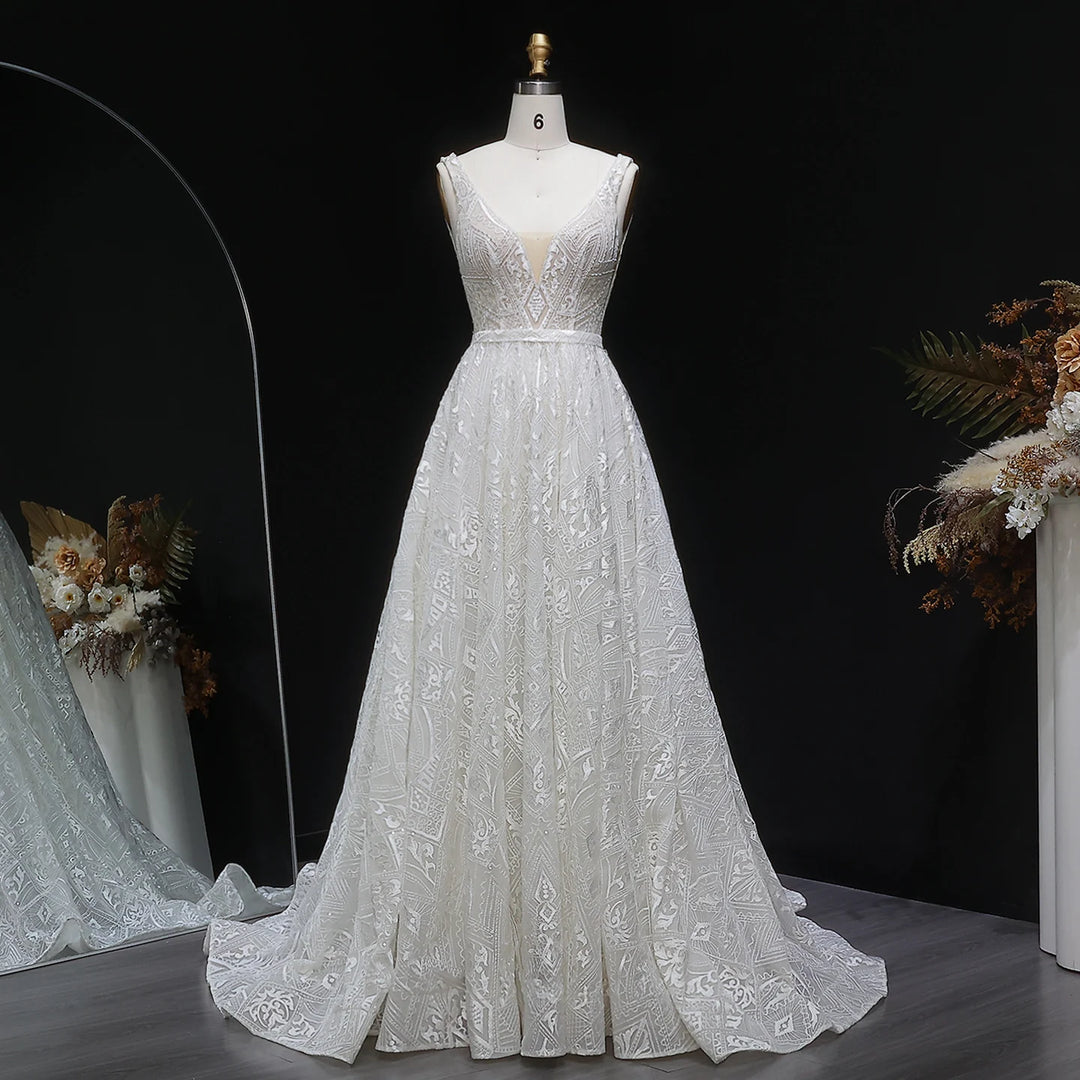 Off-white bridal gown with lace bodice and pearl applique, A-line full skirt