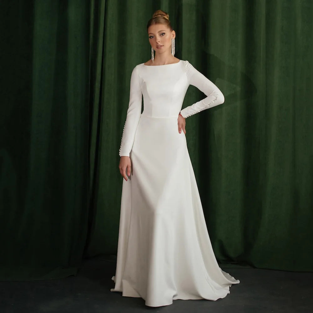 White A-line wedding dress with long sleeves and fitted bodice