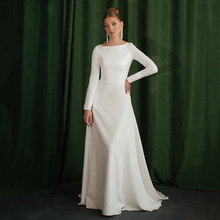 White A-line wedding dress with long sleeves and fitted bodice