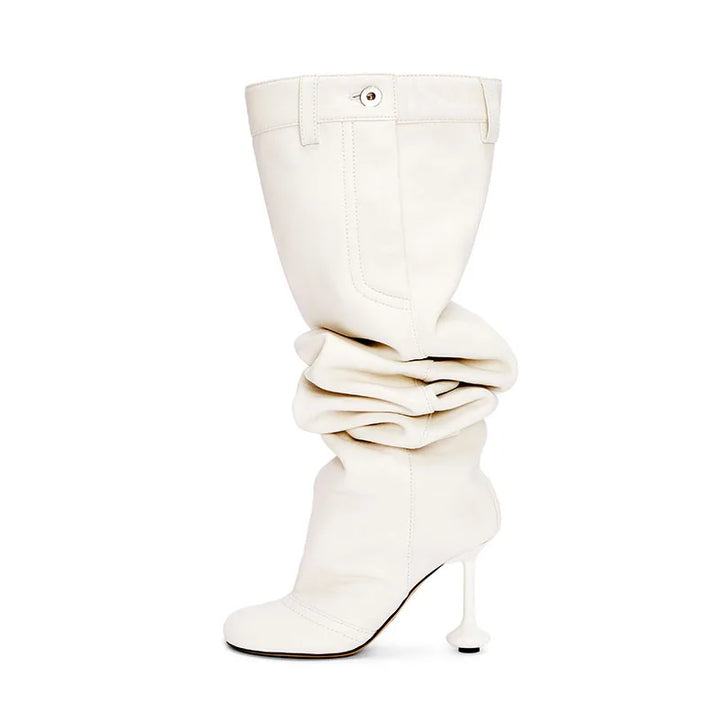 White thigh-high boots with ruched shaft, round toe, and stiletto heel