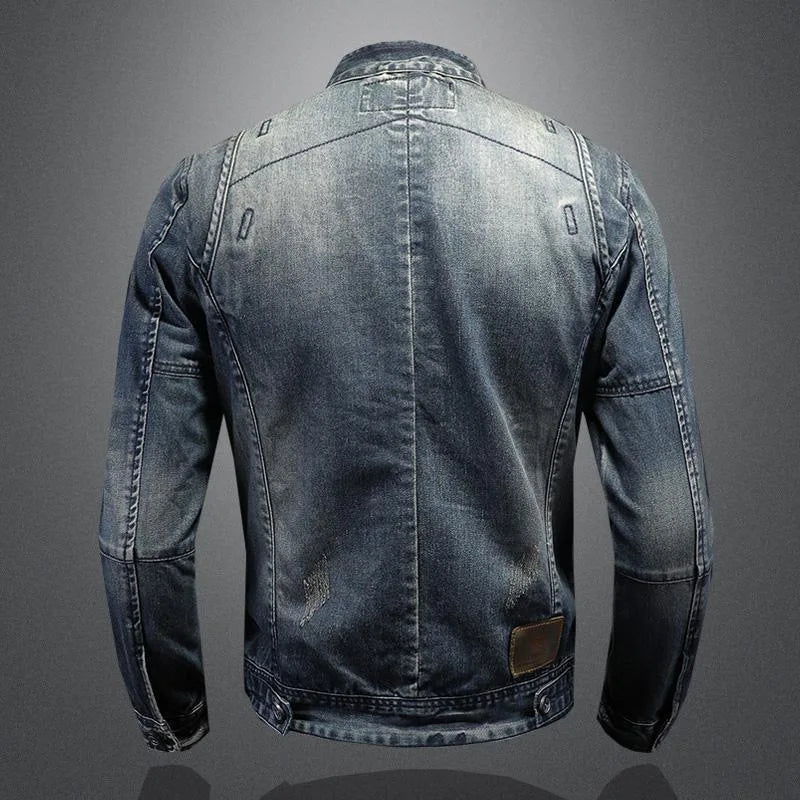 Light blue denim jacket back view with vertical seams and brown leather hem patch
