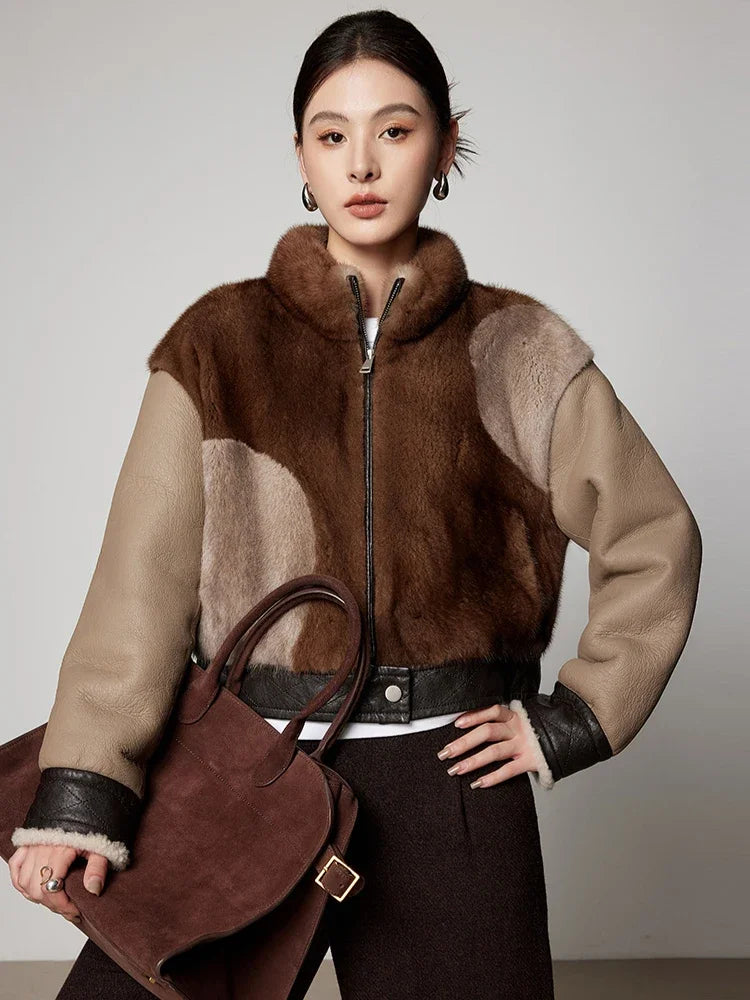 Women’s short mink fur jacket, zip front, brown and tan patch panels, leather-trim cuffs