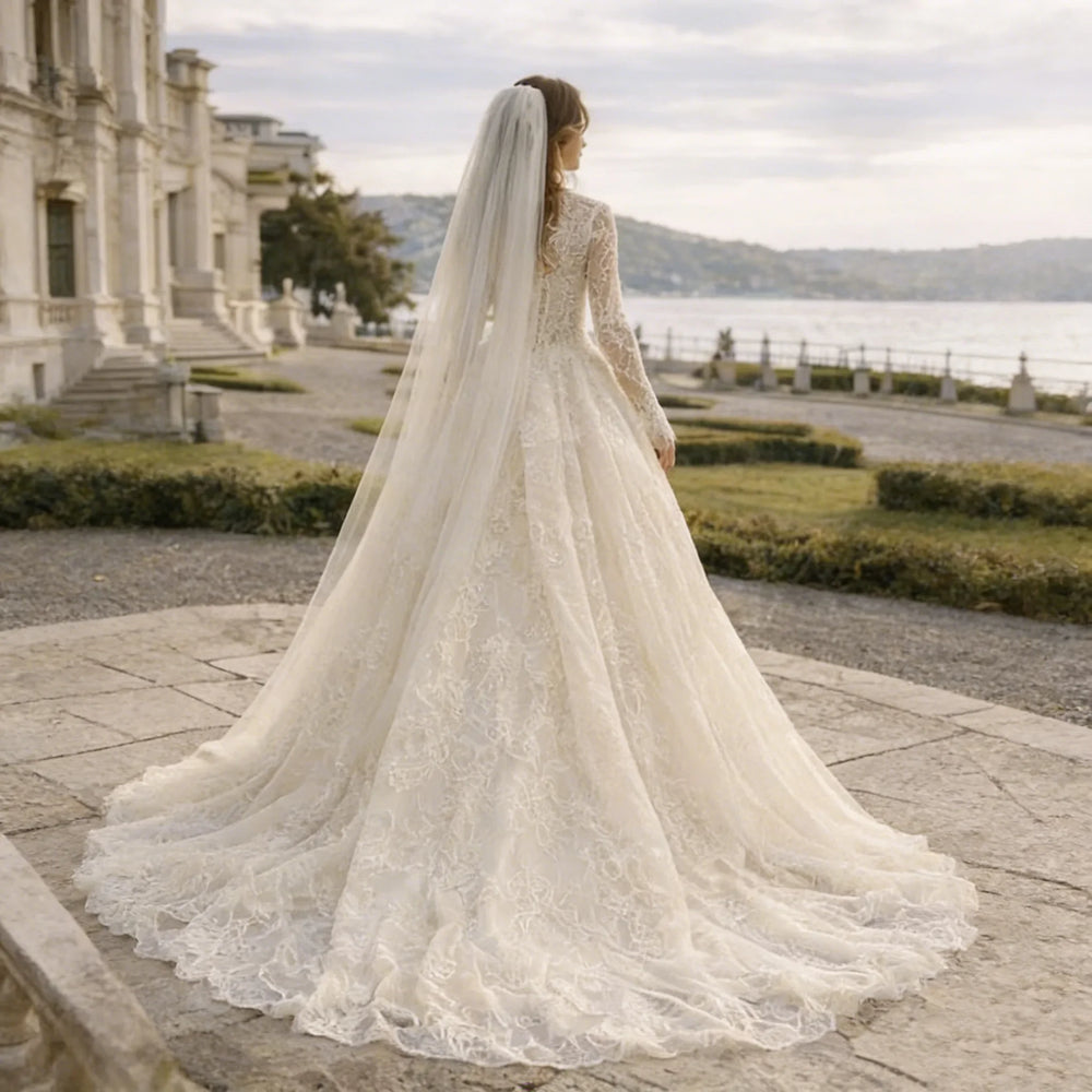 High-neck lace bridal gown back view with flowing A-line tulle skirt