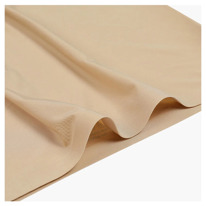 Nude ice silk fitness panties fabric close-up with soft drape and flat seams