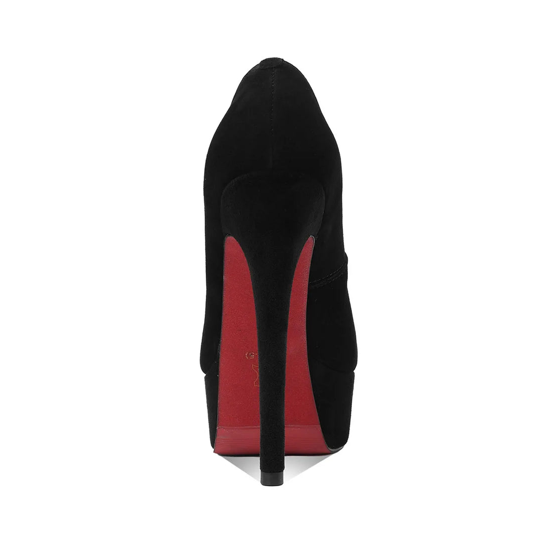Black suede round-toe heel pump from the back with slim stiletto heel