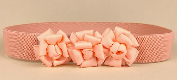 Pink corset waist belt with three fabric flower appliques across the front
