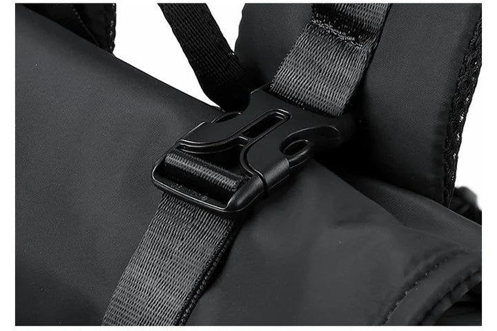Black roll-top rucksack anti-theft buckle on cross webbing strap