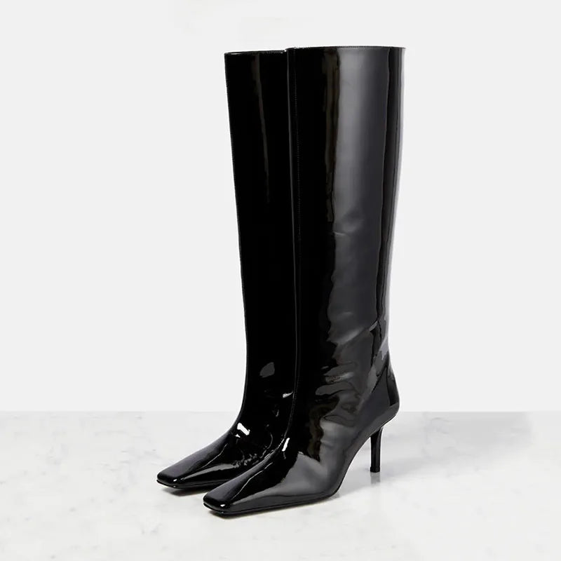 Women’s knee-high glossy black boots with pointed toe and slim heel
