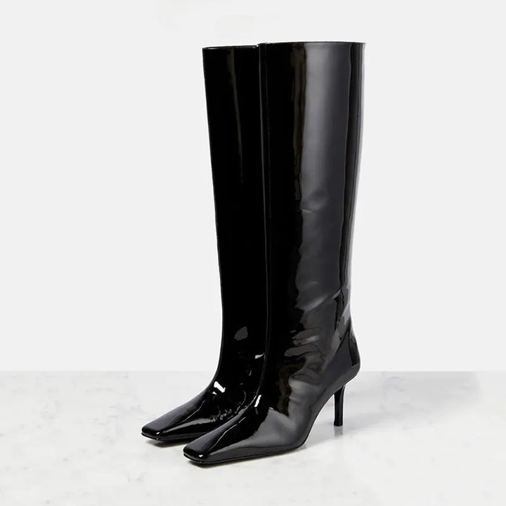 Women’s knee-high glossy black boots with pointed toe and slim heel