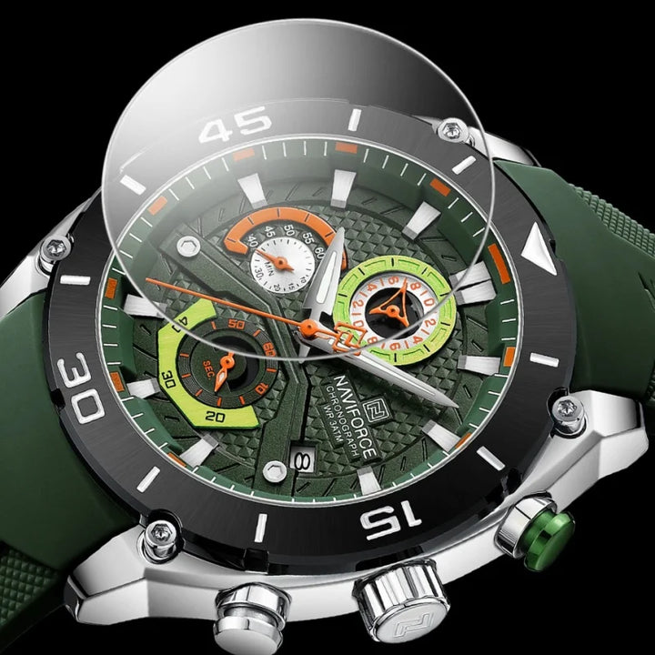 Close-up of green chronograph watch dial with orange accents and textured bezel