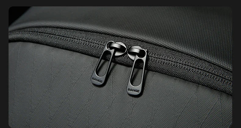 Close-up of black zipper with metal pullers on business backpack