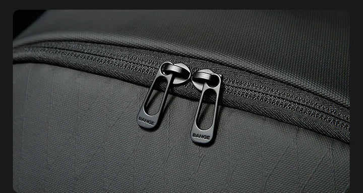 Close-up of black zipper with metal pullers on business backpack