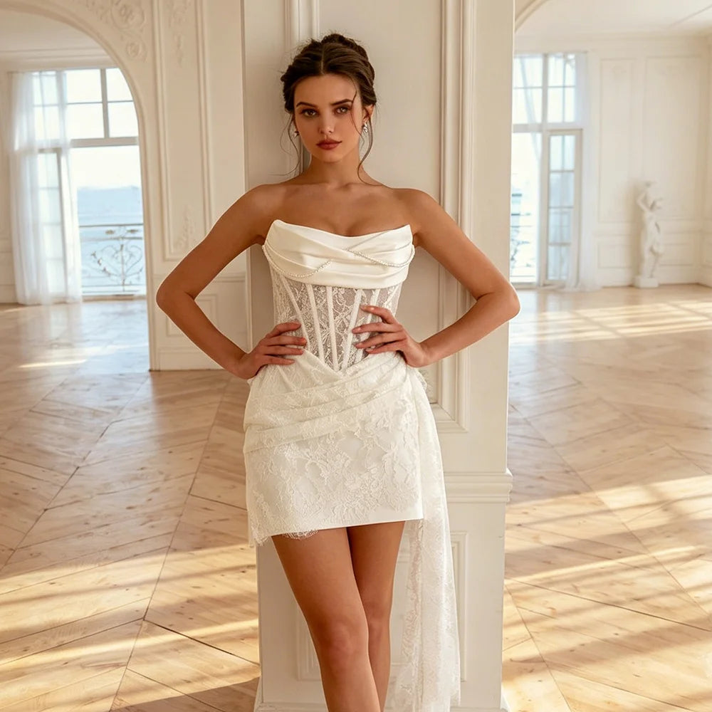 Ivory satin bridal dress with boat neck, corset bodice, and short lace overlay skirt