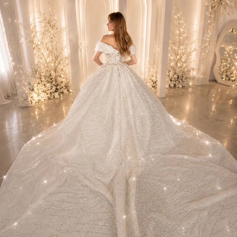 Beaded lace wedding gown from back, off-shoulder neckline and draped full skirt