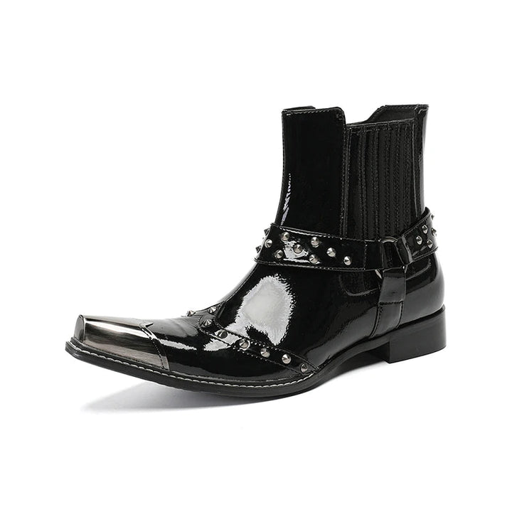 Black patent leather boot with studded details on a white background, featuring the brand &