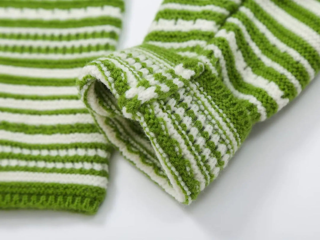 Green and white striped knit cardigan corner view with ribbed cuffs and sleeve