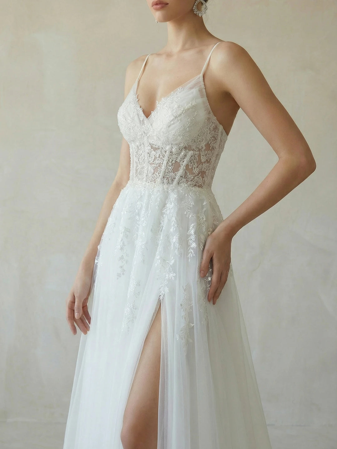 White bridal dress with lace sweetheart bodice and thin spaghetti straps