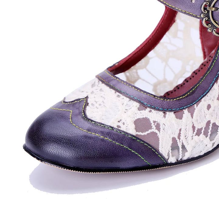 Women’s heeled sandal toe detail: white snake-print inlay, navy leather tip, contrast trim stitching