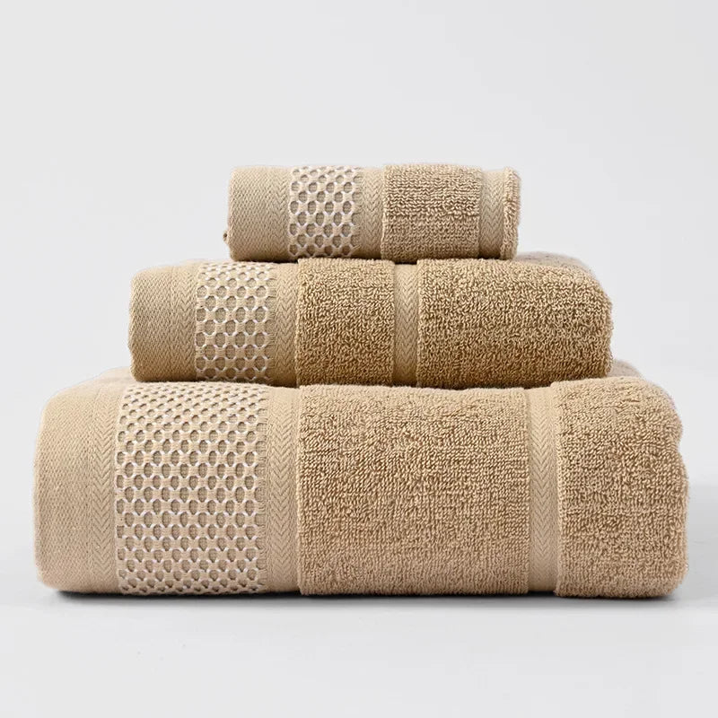 3-piece thick cotton towel set in tan, folded towels with waffle weave bands.
