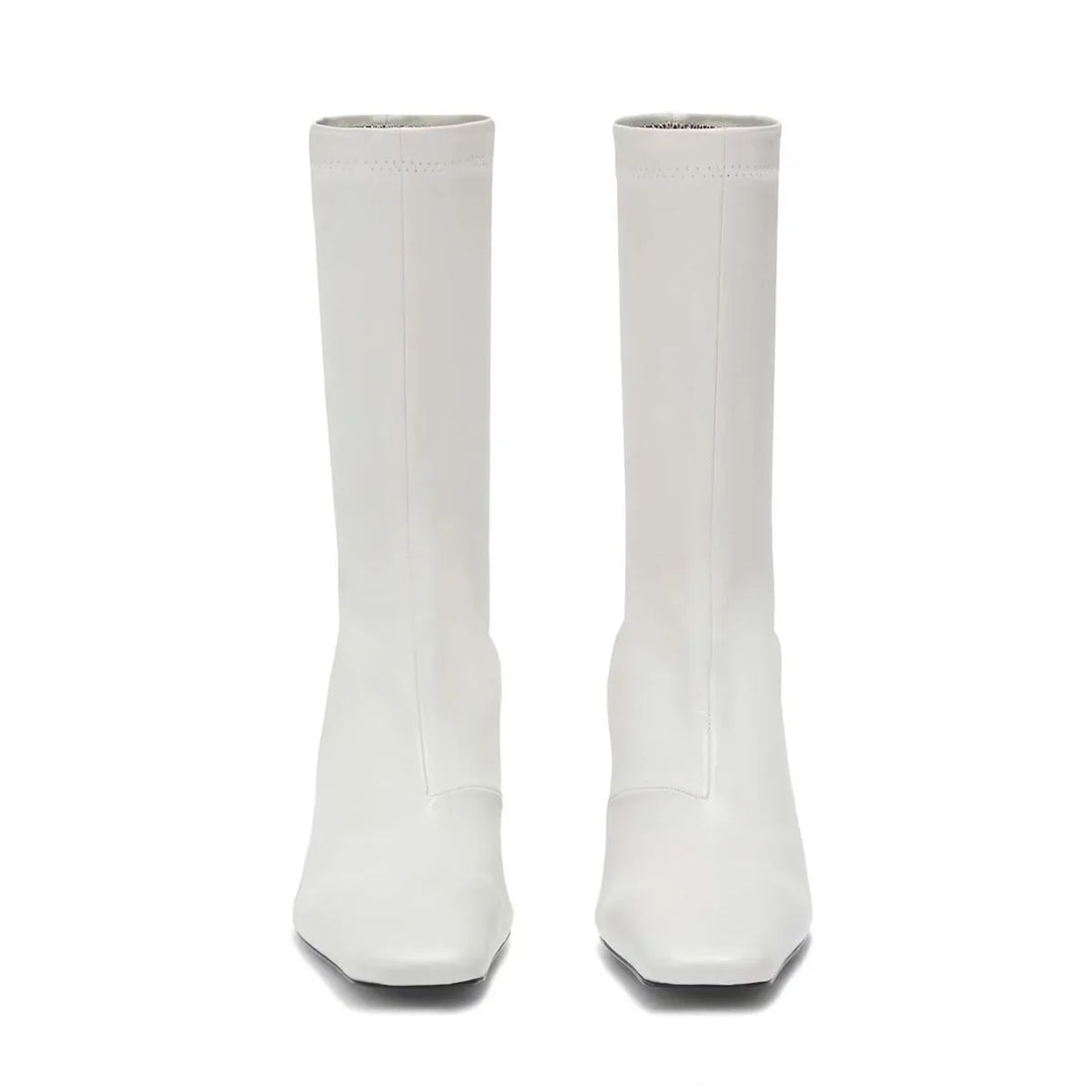Pair of white square-toe ankle boots with mid block heel, tall straight shaft