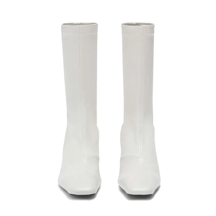 Pair of white square-toe ankle boots with mid block heel, tall straight shaft