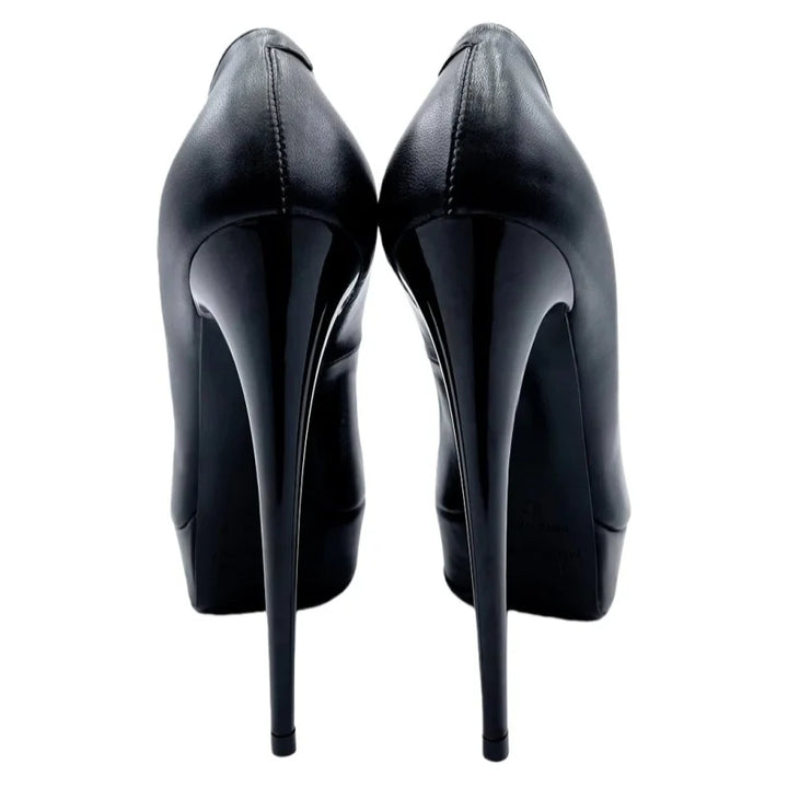 Black pointed-toe slip-on high heel pumps, back view, tall stiletto heels