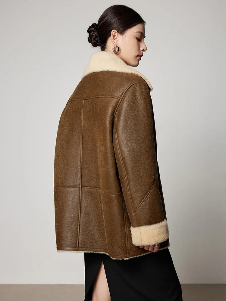 Women's loose-fit leather jacket with ivory shearling trim, back side view