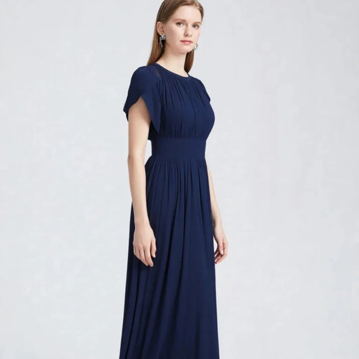 Navy women’s evening dress with ruched bodice and flowing A-line skirt
