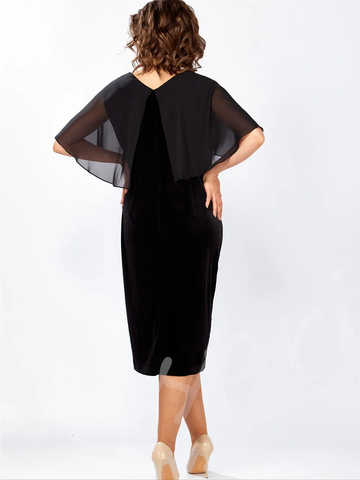 Back view of black tea-length party dress with sheer flutter sleeves