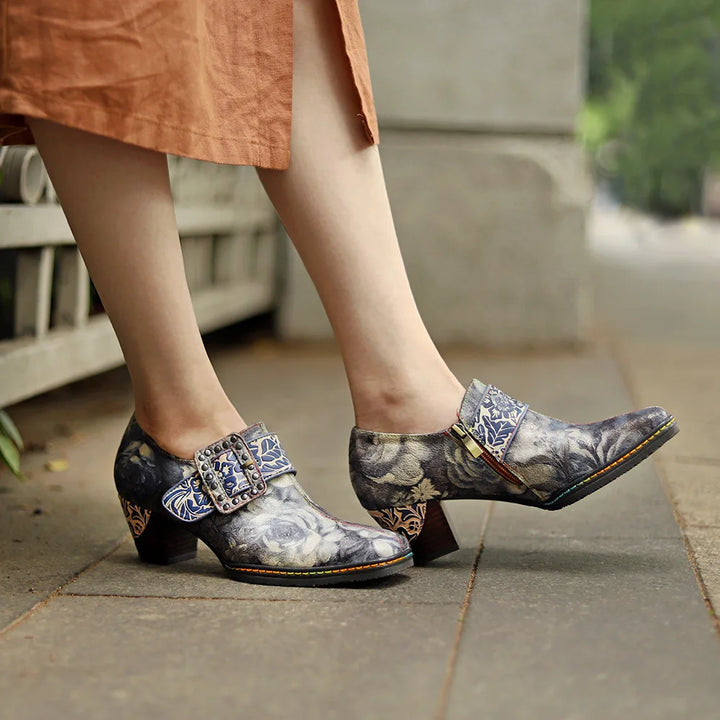 Women’s genuine leather dress pumps on model feet, blue-and-gray floral print and block heel