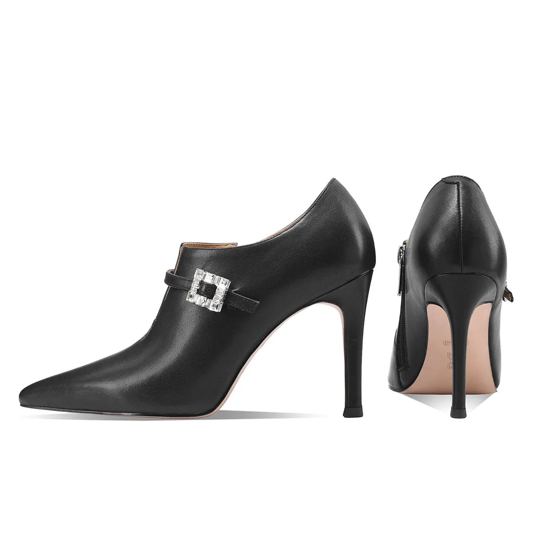 Black pointed-toe pumps shown from front and back with stiletto heels