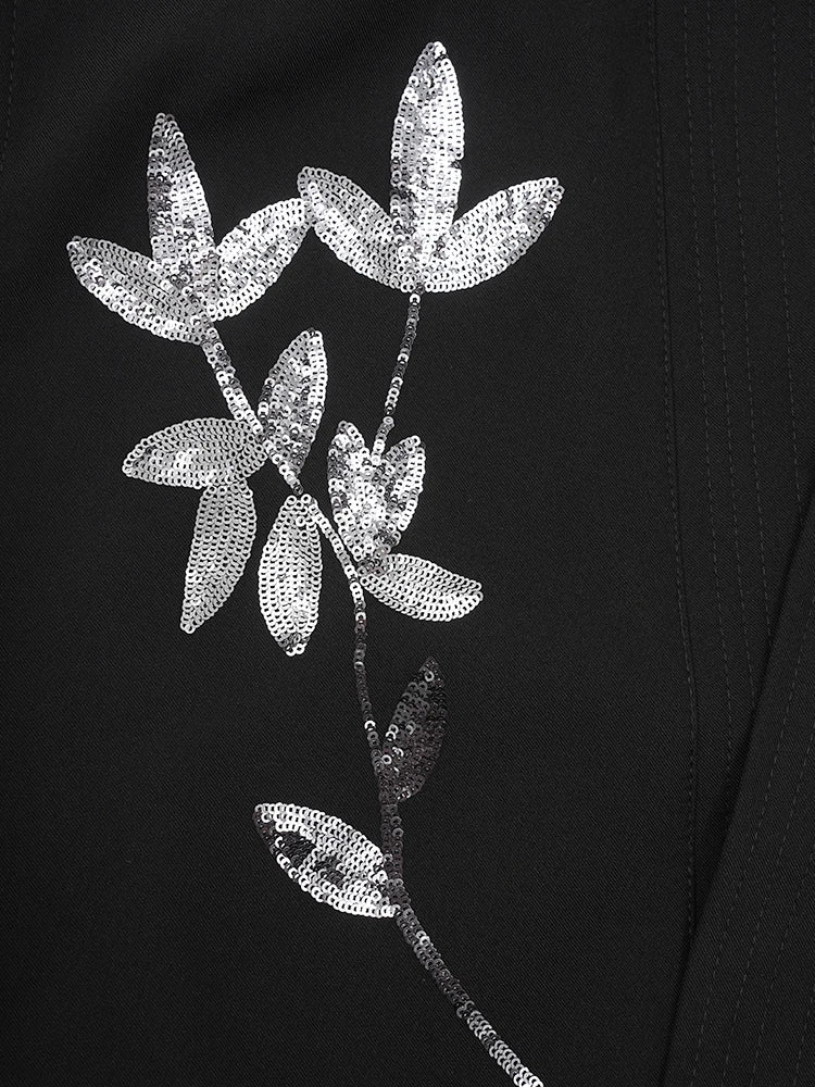 Black vest with large silver sequin floral embroidery on the front