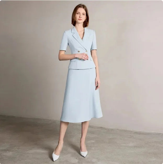 Light blue women’s blazer and midi skirt suit, front view with gold buttons