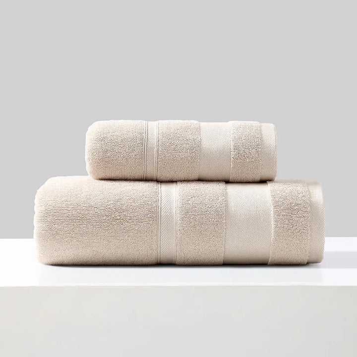 Cotton towel set of 2 in cream, folded bath towels stacked