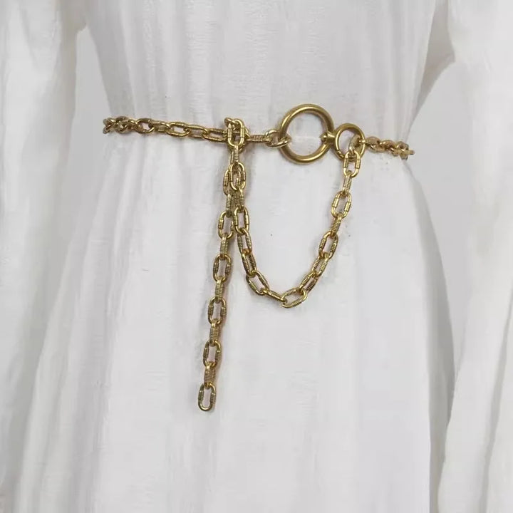 Gold metal chain waist belt with round ring clasp and hanging chain tassel
