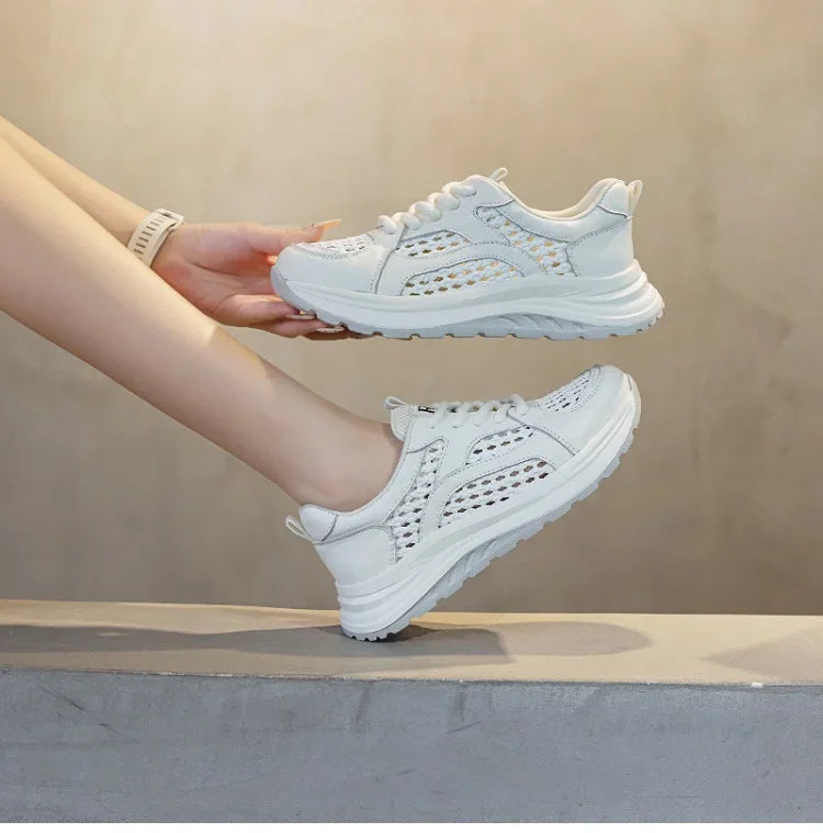 White woven mesh lace-up sneakers with padded collar and textured perforation panels.