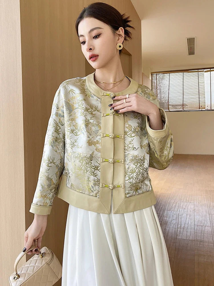 Women’s light yellow jacket with gold floral print, mandarin collar and button front