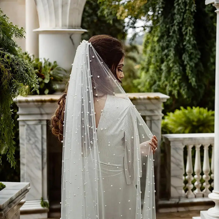 Ivory bridal veil with pearl dots and scalloped drape, side view