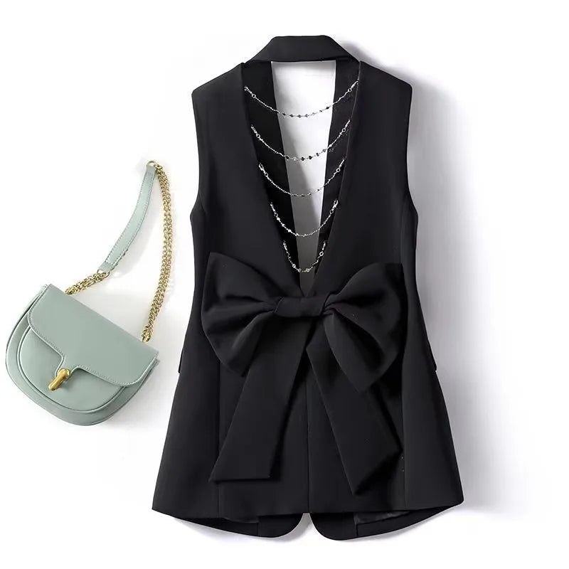 Black women's suit waistcoat vest with bow front and draped chain necklace detail